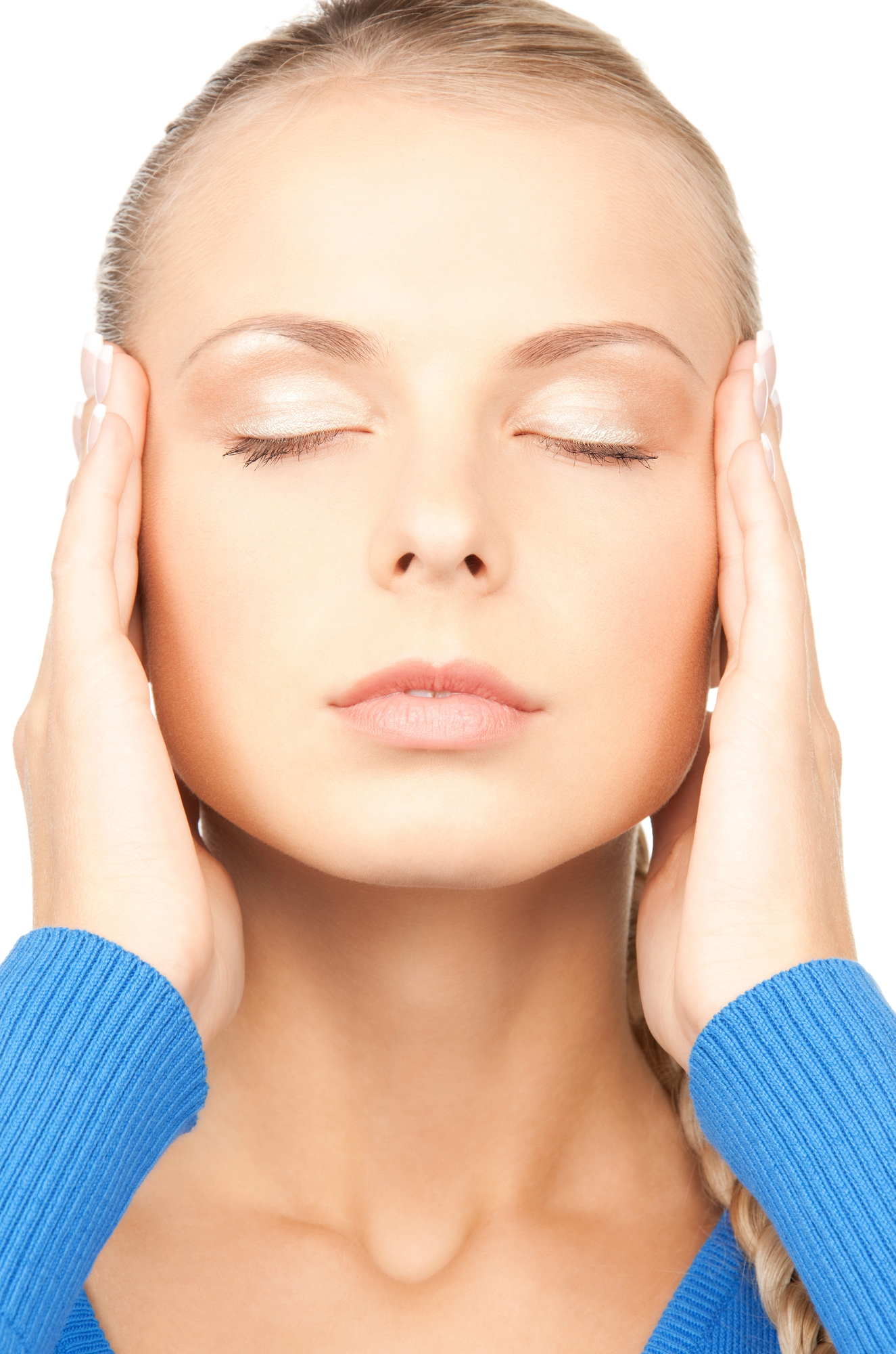 Gentle face massage for improving the look of jowls without surgery. Woman touching her temples with eyes closed, practicing a gentle facial lift technique.