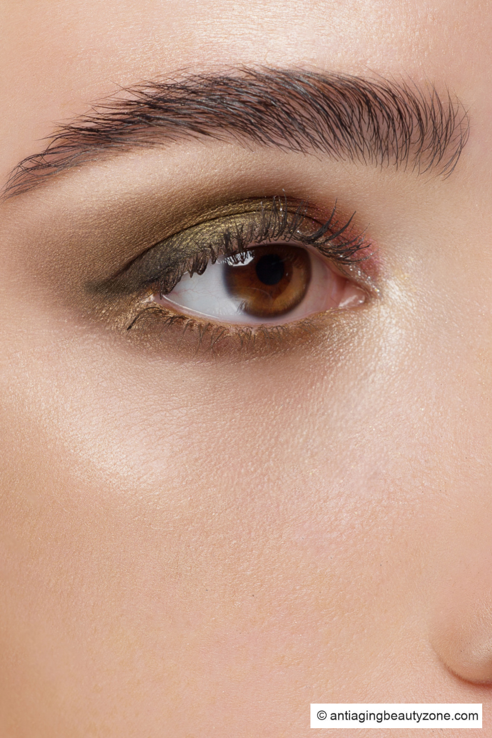 Bronze shadow and olive eyeliner angled up for downturned eyes