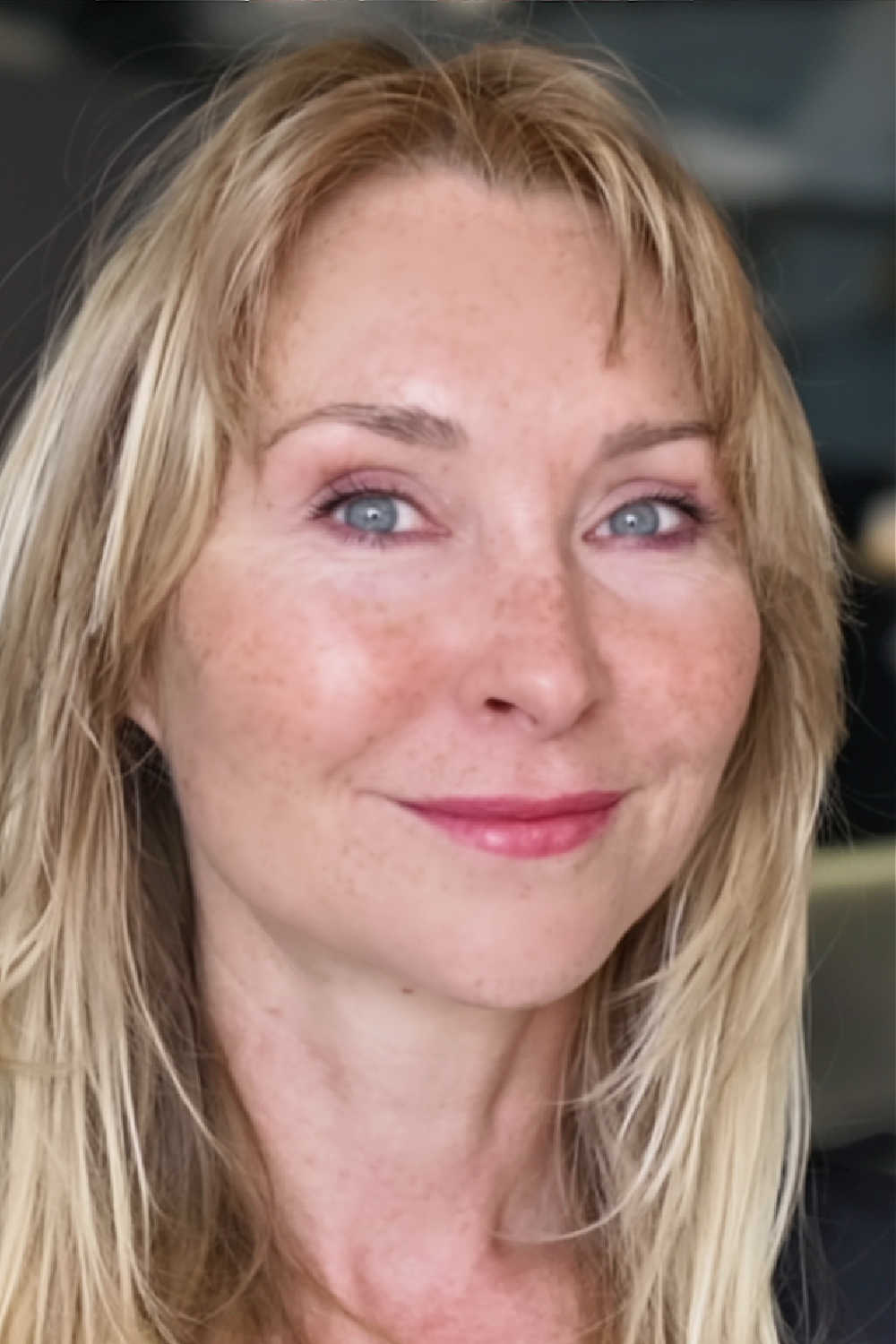 After long-term facial muscle toning—fuller cheeks, cleaner jawline. After: 15 years of facial exercises—mid-60s; fuller mid-face and a tidier jawline.