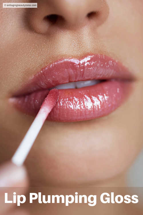 Daily habit for beautiful lips – applying hydrating lip gloss Close-up of smooth lips with glossy lip balm applied for hydration and shine
