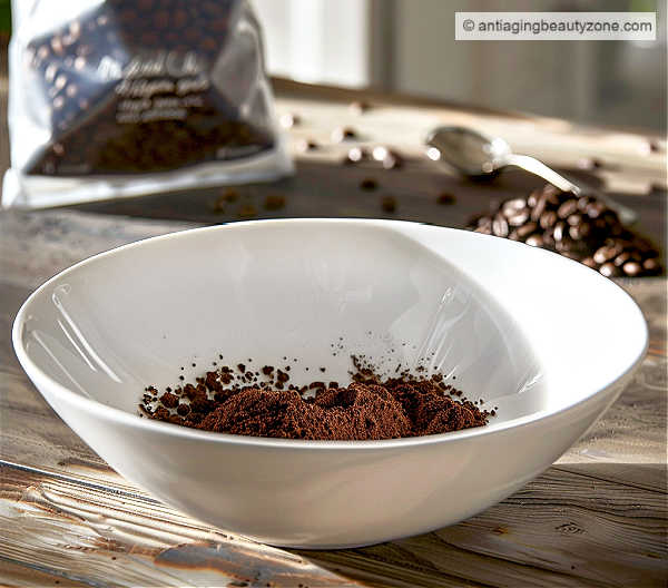 Ground coffee ready to mix into an eye mask. Bowl of ground coffee.