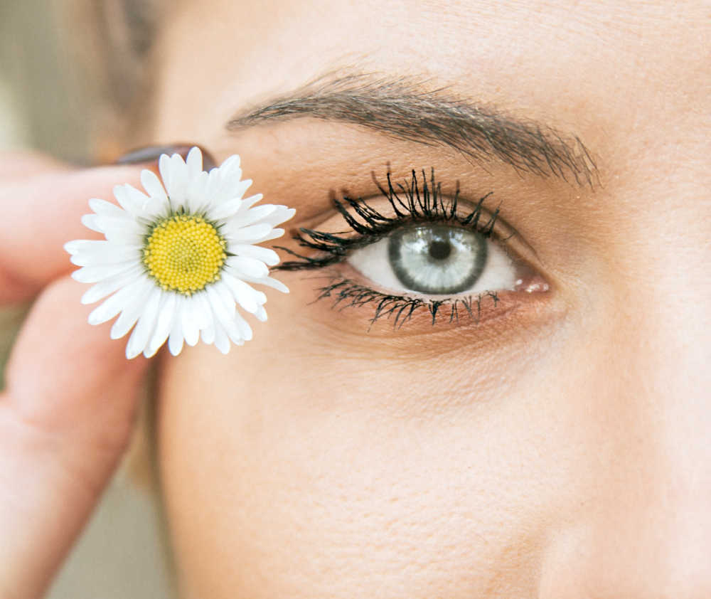 A woman with natural long eyelashes. Tips for long eyelashes.