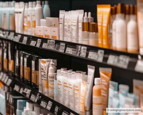 A drugstore isle filled with different types of self-tanning facial products like sprays, creams, mist, and drops.
