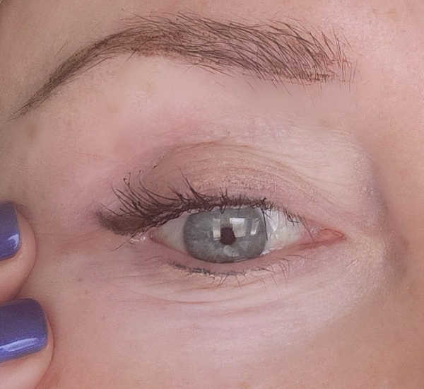 Finished tiny eyeliner flick on a mature hooded eye after adding mascara