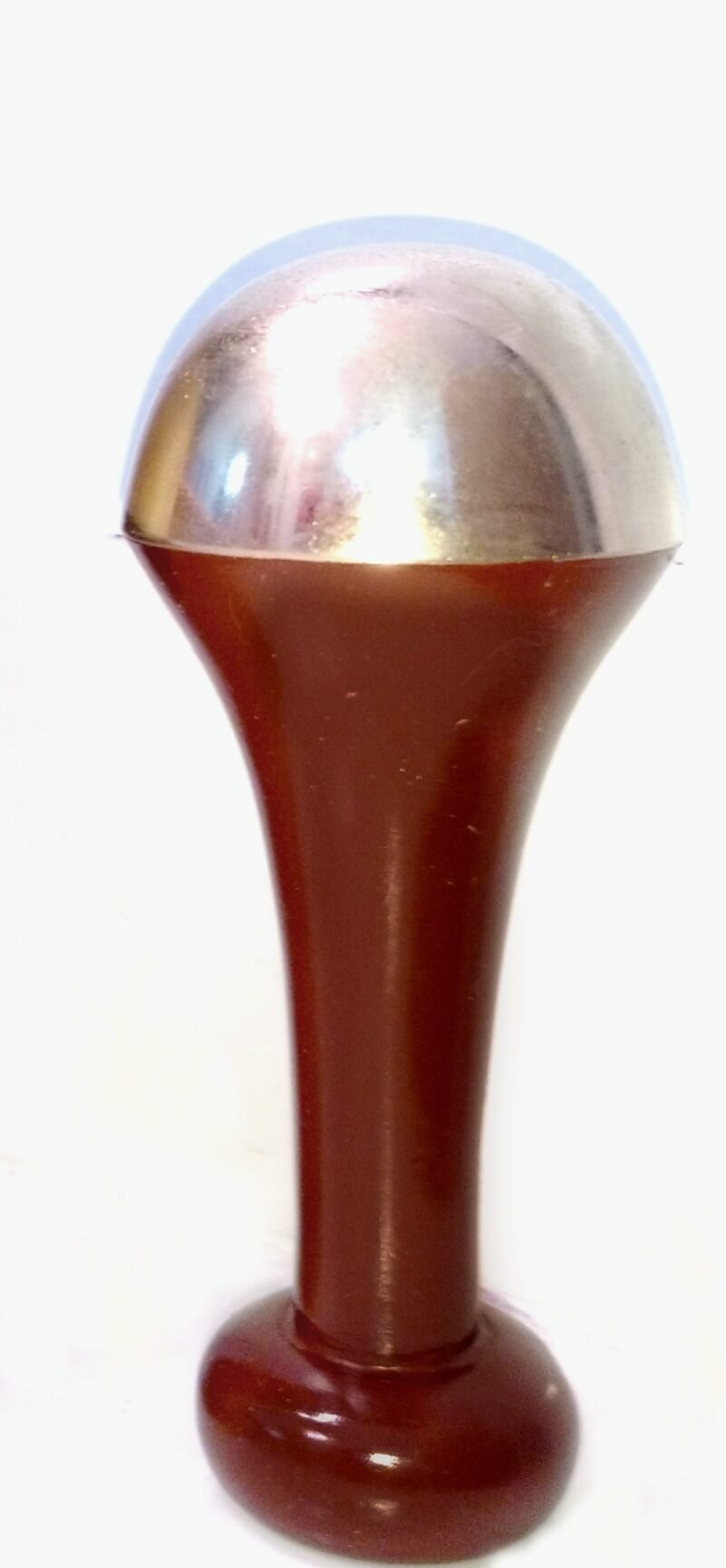 Kansa wand used for under eye and face massage.