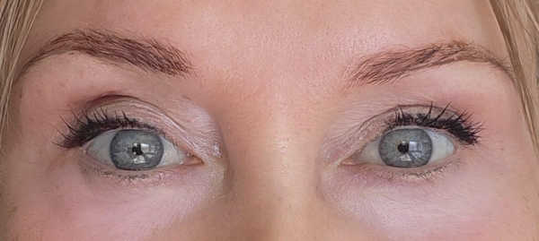 Close-up comparison of gel and liquid eyeliner showing a smoother gel line and a slightly uneven liquid liner edge on mature eyes