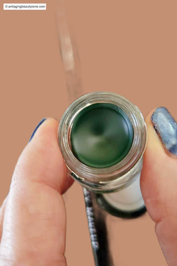 Linda Robison from Anti-Aging Beauty Zone is holding hunter green gel eyeliner for mature eyes.