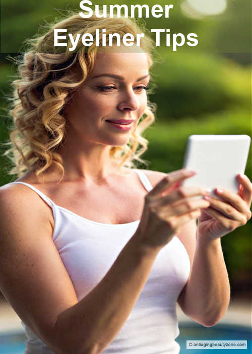 Woman over 40 wearing a white tank top, smiling while applying eyeliner tips on a summer day outdoors.