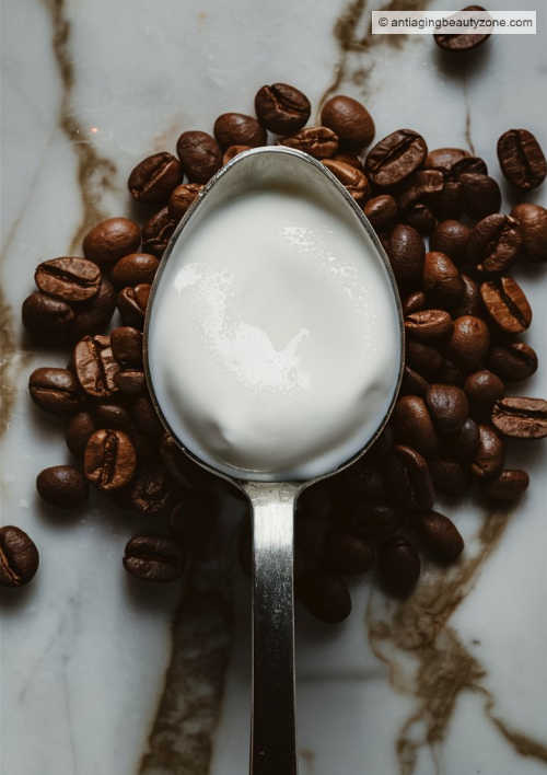 Yogurt coffee mask for eyes. A tablespoon of yogurt on top of coffee beans.