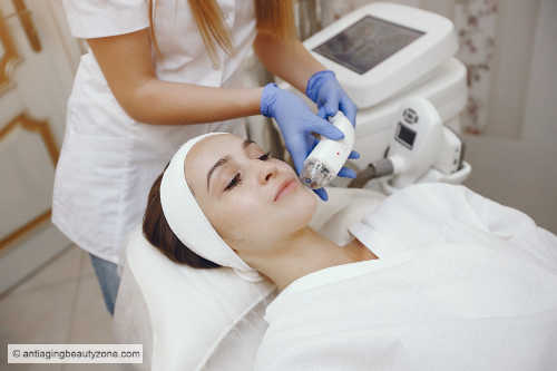 Woman receiving Ultherapy treatment under the chin to lift and tighten sagging skin and reduce the appearance of a double chin
