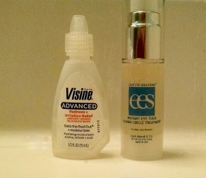 Visine eye drops next to under-eye serum for puffy eyes