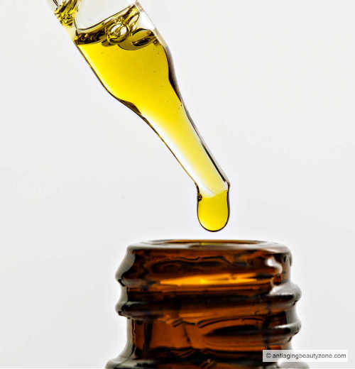 Different types of oils for face wrinkles. A dropper of oil into a brown bottle.